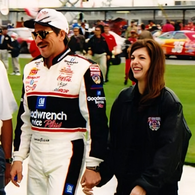 Teresa Earnhardt holding her former husband, Dale's hand after his race.